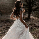 Elegant Bohemian Bridal Gown Featuring a Deep V-Neck, Short Sleeves, Exquisite 3D Floral Appliqués and a Sensual Open Back