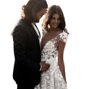 Elegant Bohemian Bridal Gown Featuring a Deep V-Neck, Short Sleeves, Exquisite 3D Floral Appliqués and a Sensual Open Back