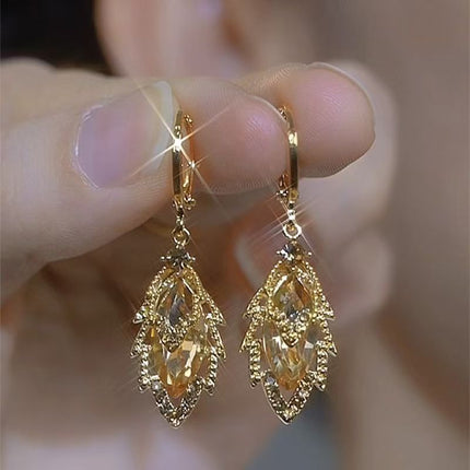 Women's earrings with stem leaf-shaped of golden Zircon elegant