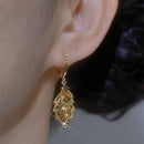 Women's earrings with stem leaf-shaped of golden Zircon elegant