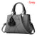 Women's handbag versatile leather zipper top handle with ball pendant