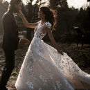Elegant Bohemian Bridal Gown Featuring a Deep V-Neck, Short Sleeves, Exquisite 3D Floral Appliqués and a Sensual Open Back